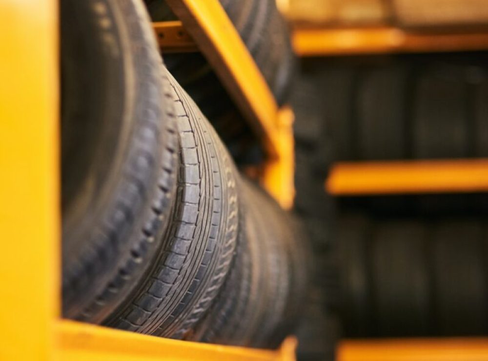 Workshop full of wheels. Closeup shot of a pile of car tyres.